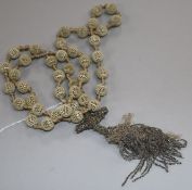 A reticulated ivory bead and tassel drop rosary necklace, 100cm.