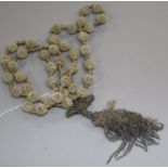 A reticulated ivory bead and tassel drop rosary necklace, 100cm.
