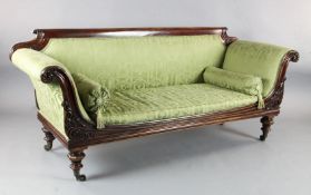 A William IV mahogany scroll end settee, with pale green fabric upholstery, 7ft. D. 2ft 5in. H.2ft
