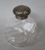 A Victorian embossed silver mounted glass scent bottle