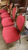 A set of four Louis XV style gilt carved wood salon chairs
