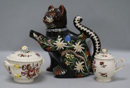 A Swiss peasant pottery cat teapot and Leeds creamware jars