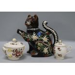 A Swiss peasant pottery cat teapot and Leeds creamware jars