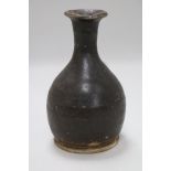 A Chinese brown glazed bottle vase, Song dynasty 6.5in.