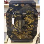 A Japanese gilt decorated black lacquer cabinet, H.49cm W.35.5cm