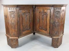 An 18th century French oak corner armoire, with two doors, on bracket feet, W.5ft 8in. D.1ft 10in.