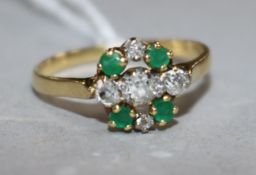 An 18ct gold, emerald and diamond cluster ring, size Q.