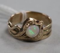 A yellow metal, white opal and gem set serpent ring, modelled as a King Cobra, size Q.