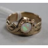 A yellow metal, white opal and gem set serpent ring, modelled as a King Cobra, size Q.