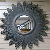 A green painted wood sunburst mirror, from Heals, W.3ft 4in.