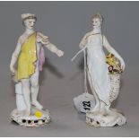 A pair of German porcelain figures of a lady and a youth 5.5in.