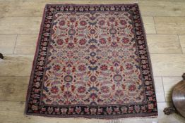 A Persian cream ground mat, 3ft 6in. x 2ft 11in.