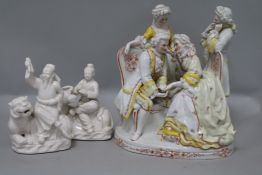 A porcelain figure and two Chinese ornaments