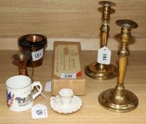 A pair of 18th century brass candlesticks and sundries, including an Aynsley 1919 'Peace' mug and