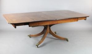 A Regency mahogany extending dining table, in the manner of William Pocock, the reeded D end top