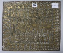 An Indian brass repousse-work panel, 18th/19th century, decorated with a procession of figures, 31cm