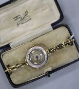 A lady's early 20th century 9ct gold and enamel manual wind wrist watch.