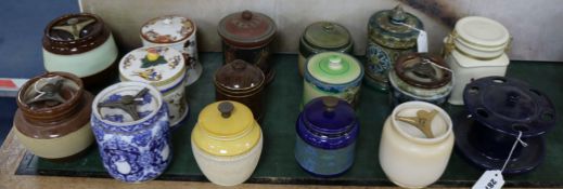 A Royal Doulton tube-lined tobacco jar, fifteen other tobacco jars, various and a pottery pipe