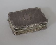 A Victorian engine turned silver vinaigrette by Thomas Dones, Birmingham, 1861, 44mm.