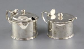 Two George IV silver drum mustards by William Eaton, with engraved crests, London, 1820 and two