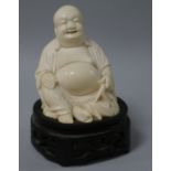 A Chinese ivory figure of Budai wood stand