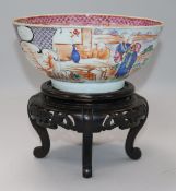 An 18th century Chinese famille rose bowl and wood stand, Diameter 18.5cm, H.8.5cm without stand