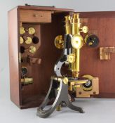 A Henry Crouch compound binocular microscope, early 20th century, serial number 4459, with 11