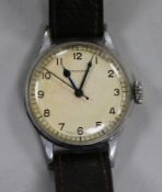 A gentleman's steel Longines military issue manual wind wrist watch, case back engraved with broad