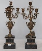 A pair of Victorian spelter and marble four-light candelabra, possibly part of a clock garniture (