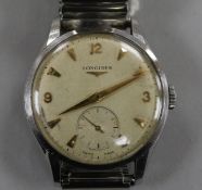 A gentleman's 1950's? stainless steel Longines manual wind wrist watch, with Arabic and arrowhead