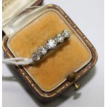 An early 20th century 18ct gold and graduated five stone ring, size O.