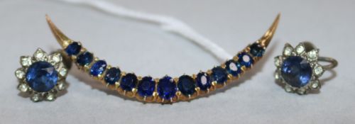 A yellow metal and sapphire crescent brooch and a pair of paste earrings.