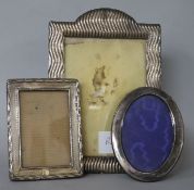 Three assorted silver mounted photograph frames.