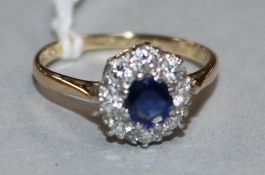 An 18ct gold and platinum, sapphire and diamond ring, size O.