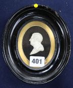 A Regency carved ivory profile relief of a Roman emperor, in ebonised and gilt oval frame 2in.