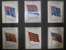 An album of silks and cigarette card sets; including Kensitas British Empire Flags & National Flags,