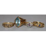 Three 18ct gold gem set rings and one 15ct gold gem set ring.