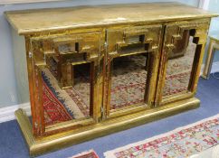 A Rodolfo Dubarry brass overlaid three door side cabinet, W.5ft 2in.