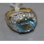 A modern 18ct gold, aquamarine and diamond cluster ovoid dress ring, size R.