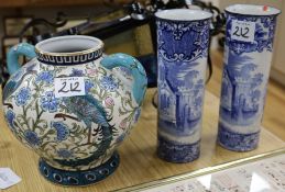 A modern Persian style two handled vase and a pair of blue and white sleeve vases