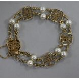 A Chinese 14ct gold and cultured pearl bracelet, gross weight 13.4 grams.