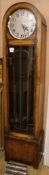 A 1930's oak cased thirty hour chiming longcase clock, H.6ft