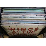 A box of mixed LP's containing The Beatles, Wings, Creedence Clearwater Revival, The Stranglers,
