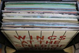 A box of mixed LP's containing The Beatles, Wings, Creedence Clearwater Revival, The Stranglers,