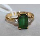 An 18ct gold and platinum, green tourmaline and diamond ring, size M.