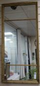 A rectangular gilt frame triple plate wall mirror, 1ft 8in x 3ft 6in.