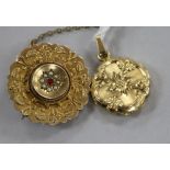 A Victorian 9ct gold and gem set brooch and a gold plated pendant.