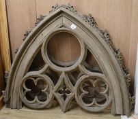 A pair of Victorian oak upper window frame sections of Gothic design, W.4ft 9in. H.3ft 8in.
