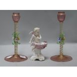 A pair of Venetian glass candlesticks and a Continental porcelain cherub