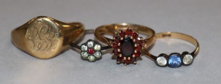 Three 9ct gold and gem set rings and a 9ct gold signet ring.